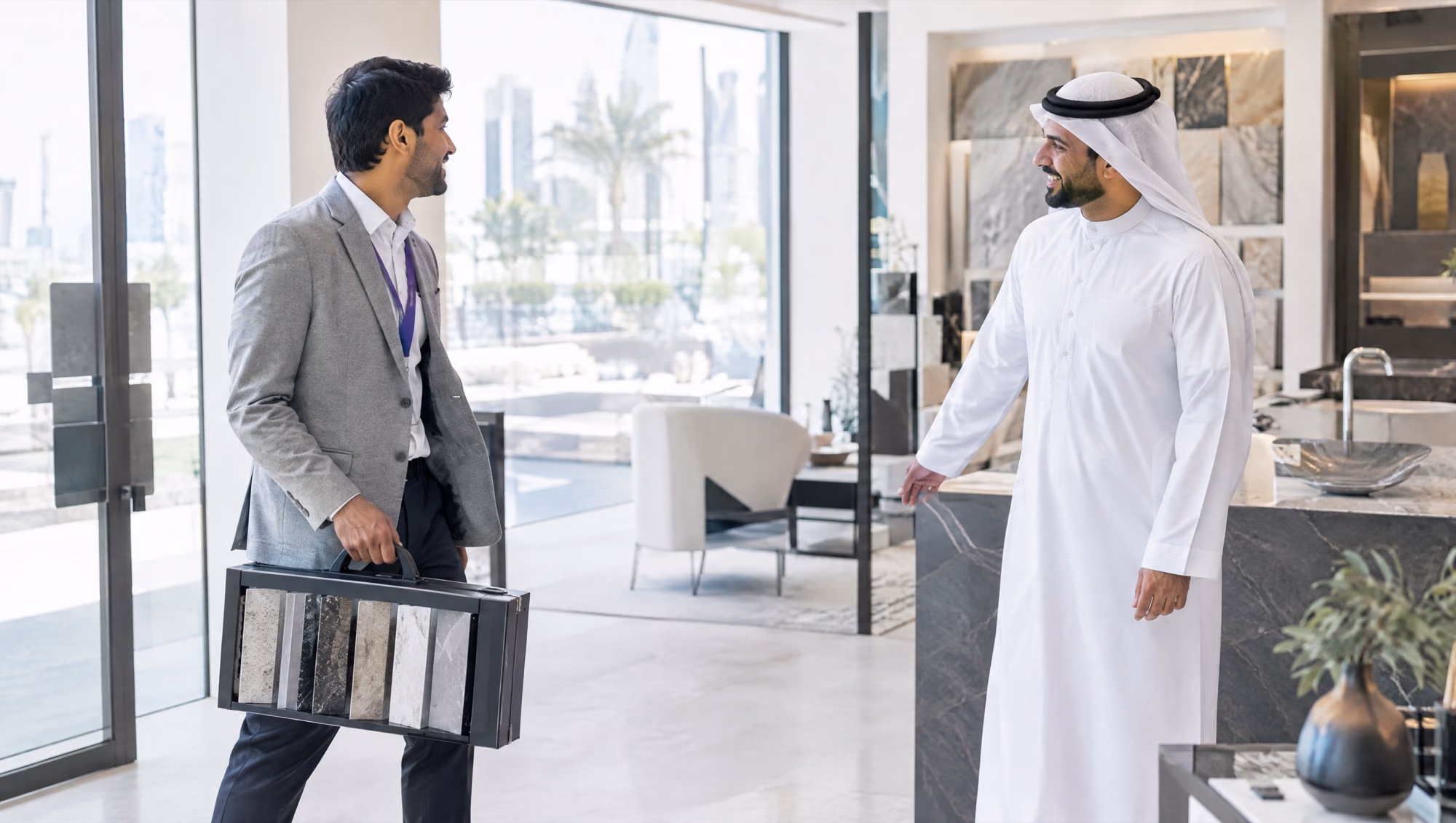 An independent sales agent carrying a sample case into a customer's showroom